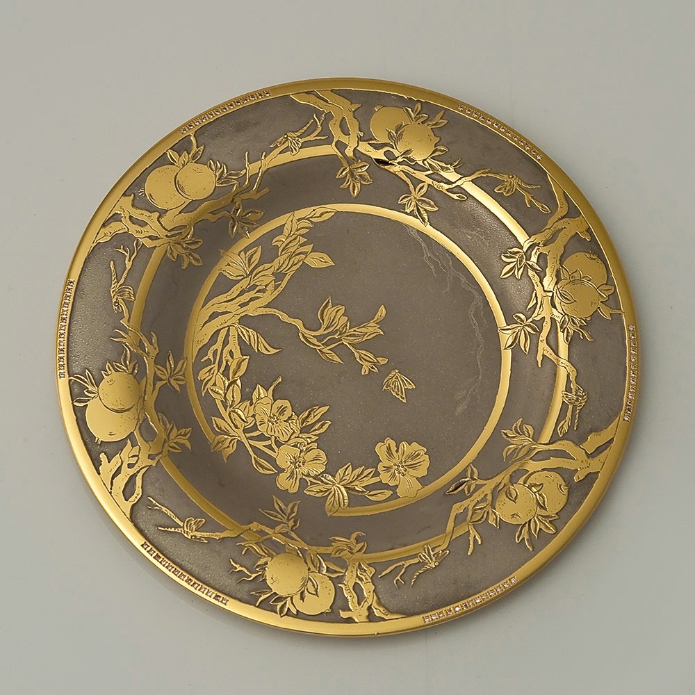 Small dish decorated with engraving and gold