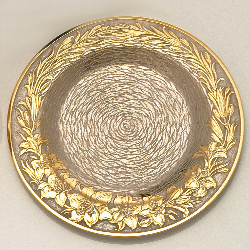 A small dish with amazing gold engraving