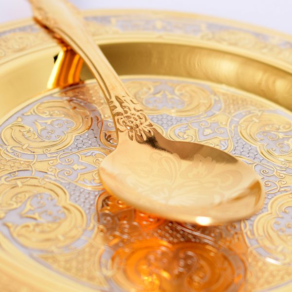 Golden spoon on the saucer art