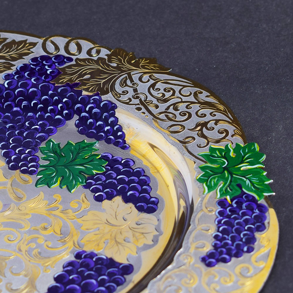Dish decorated with cutter and enamel