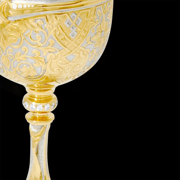 Luxury engraving on a golden cup goblet