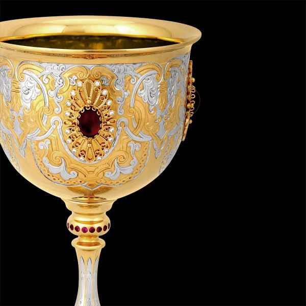 Golden goblet with burgundy crystal on the bowl