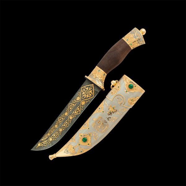 Variant of men's gift for the UAE Independence Day. Handmade knife with a gold falcon on a scabbard.