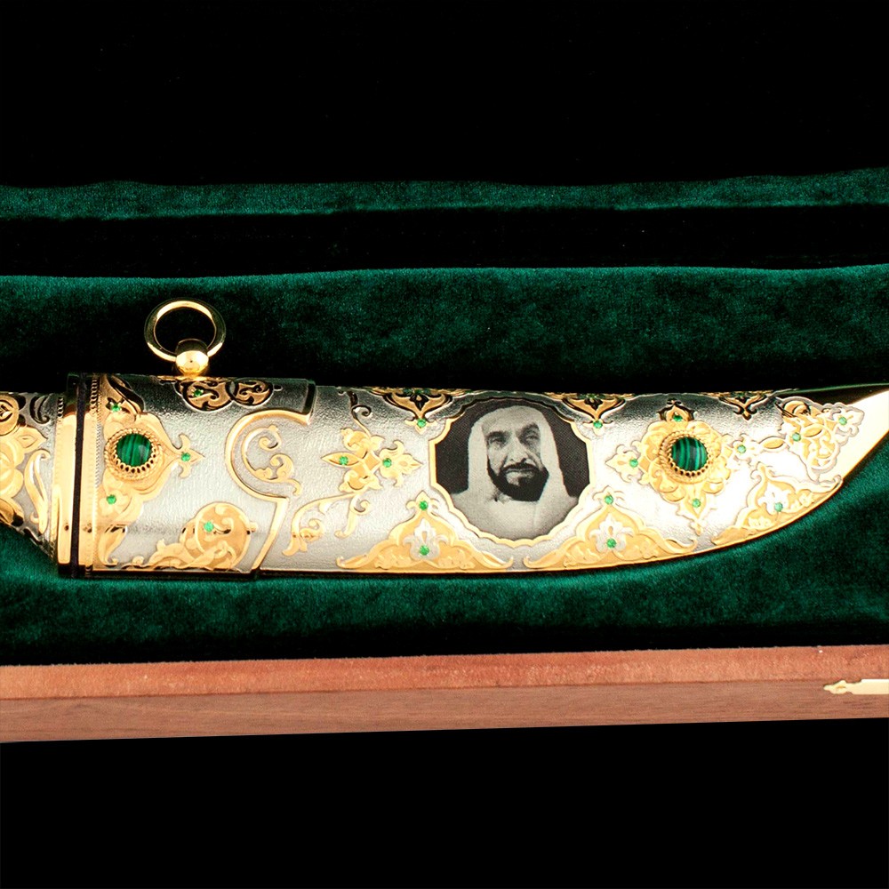 Luxurious scabbard of a golden knife decorated with the image of "Father of the UAE nation"