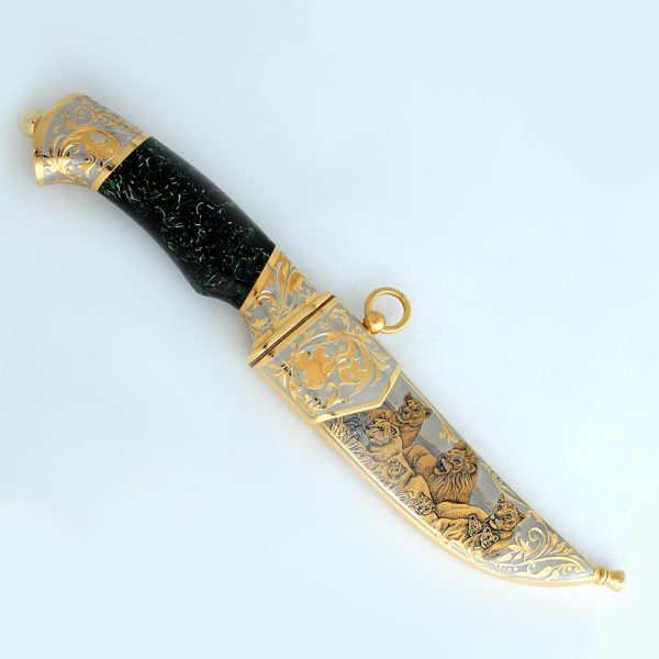 Golden knife with the image of the lion family