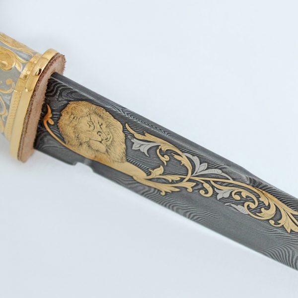 Golden lion on a blade from Damascus