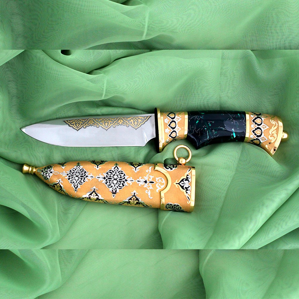 Arabian knife with a green hilt. Luxurious handmade knife with expensive sheath trim.