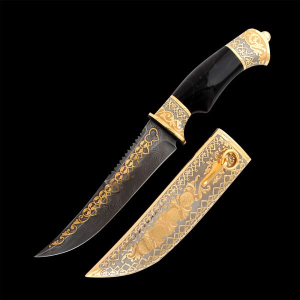 Gift knife in arabic style. Damask steel blade decorated with gold ornament