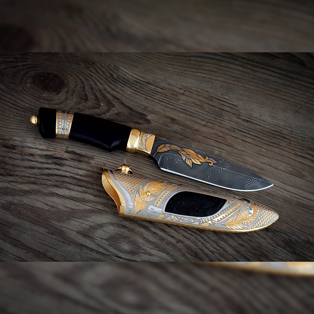 Handmade knife decorated with golden ears of wheat