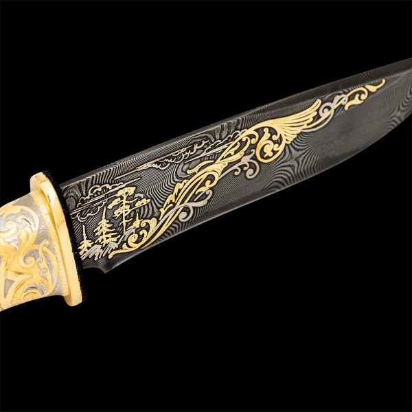 Damascus steel knife blade with persistent gold pattern.