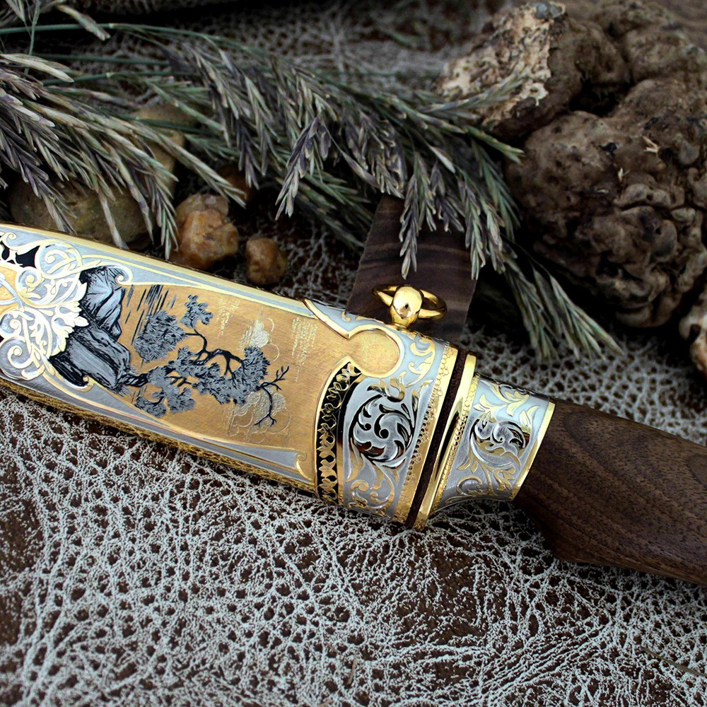 Luxurious handmade knife. Exclusive art engraving of the sheath and knife handle elements