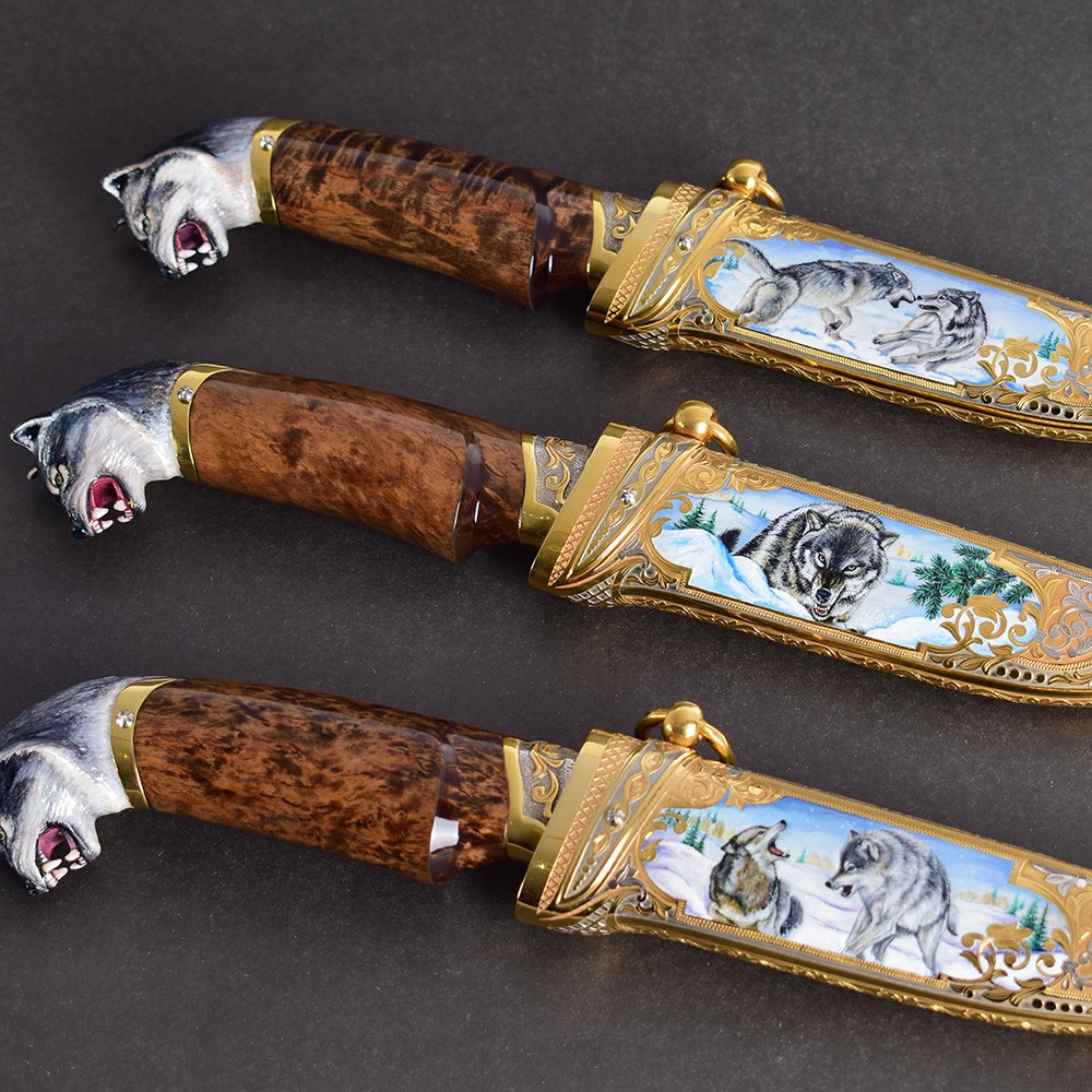 Three handmade knives with a wolf hilt