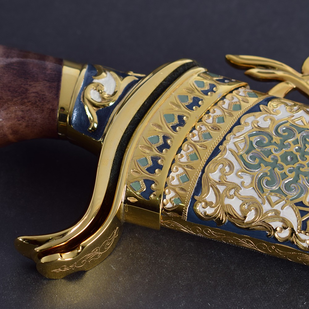 Gold knife with color art decoration