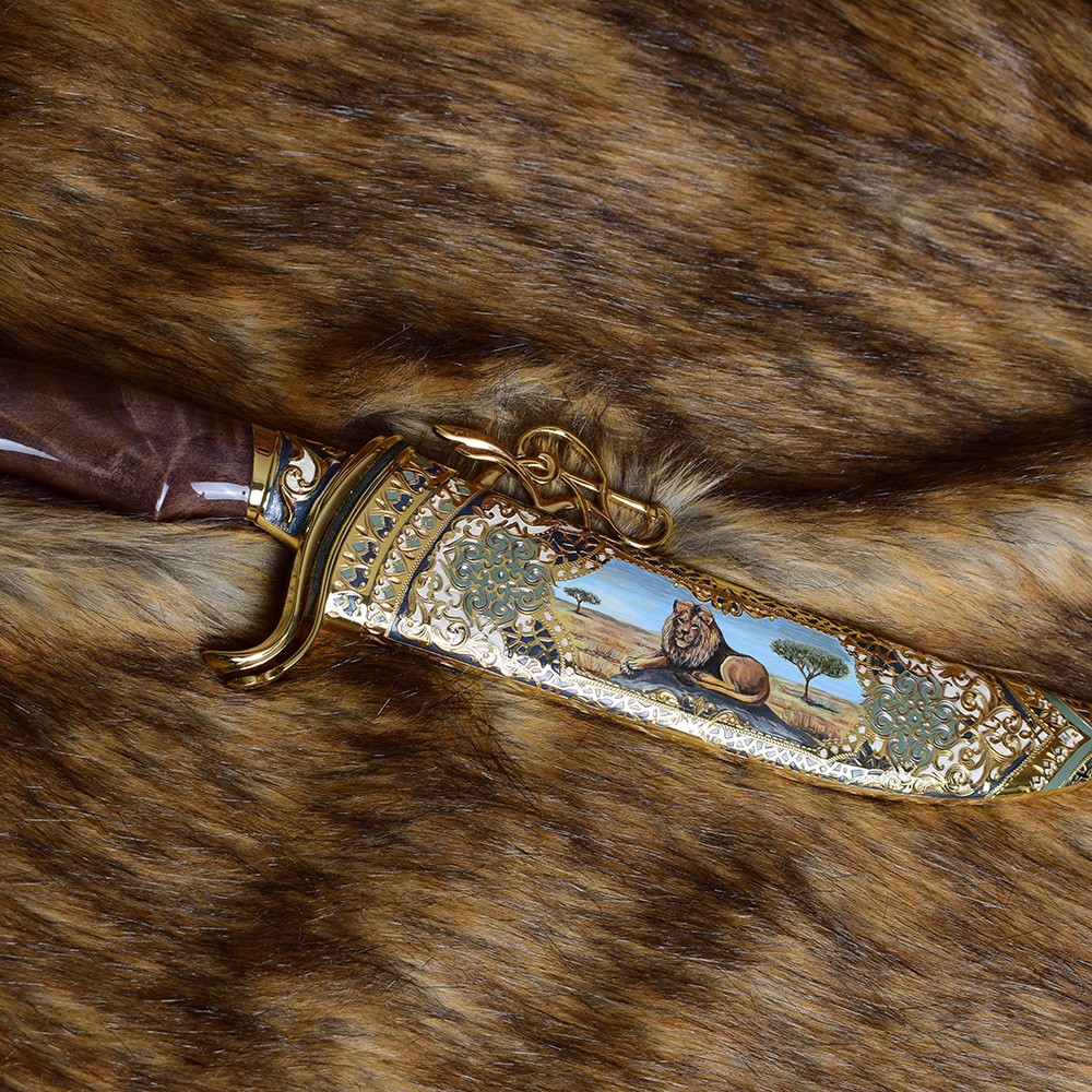 Luxurious large knife with a colored pattern of a lion in the African savannah