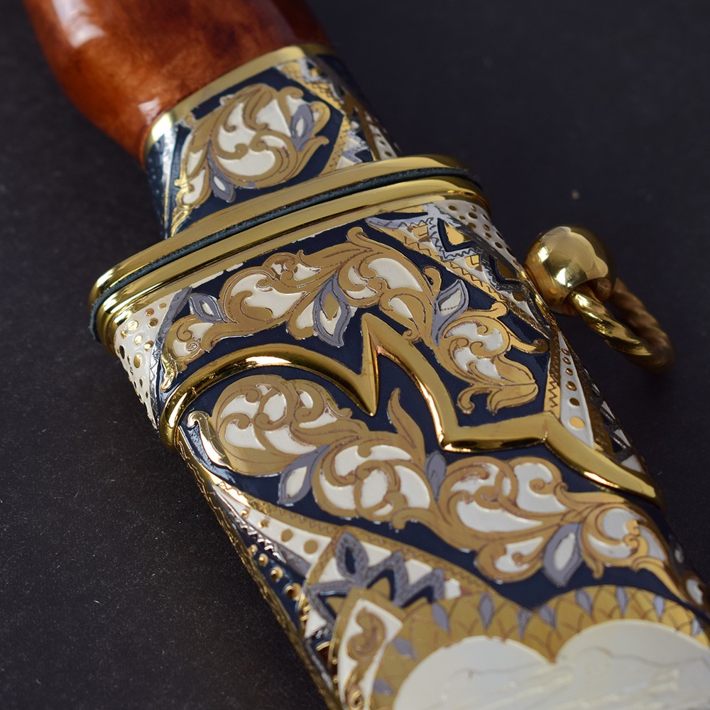 The all-metal sheath of the knife coated with a complex pattern. Handwork of Russian masters.