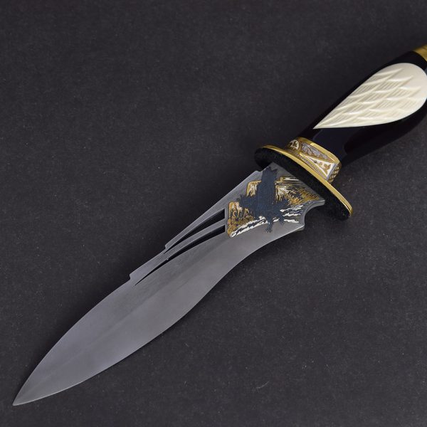 Handmade knife with a stylish blade decorated with an eagle.