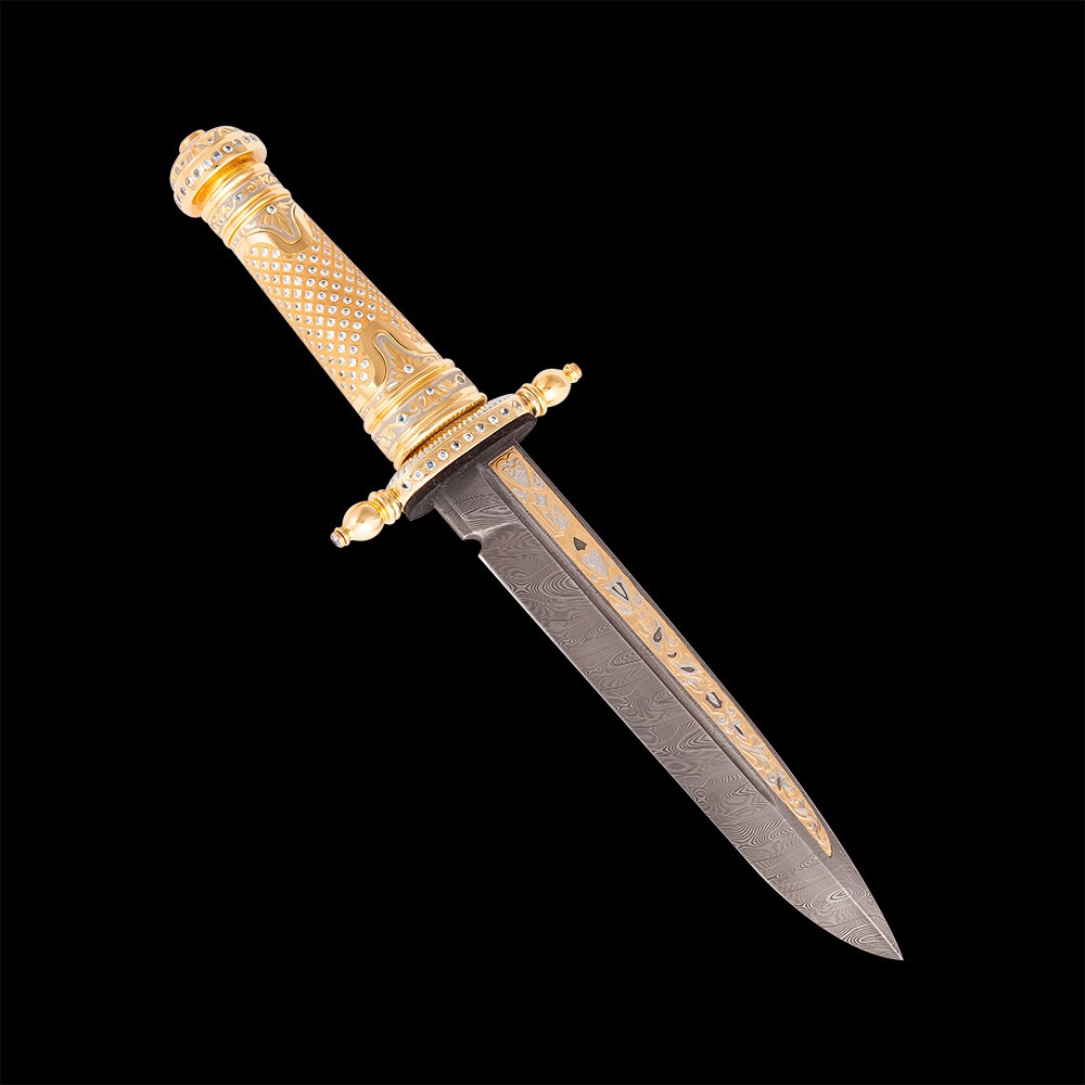 A small dagger of Damascus steel similar in appearance to a sword