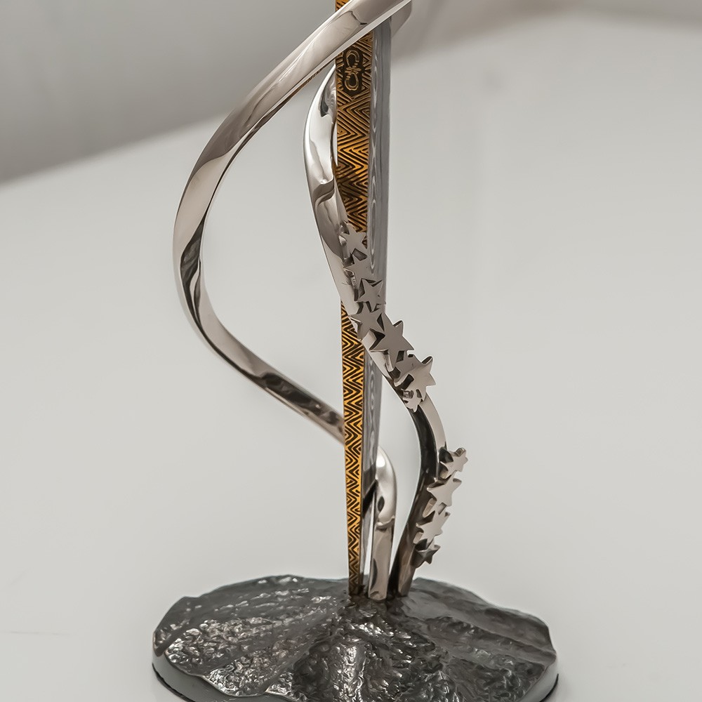 Blade of a knife on a stand decorated with a star. Author's work