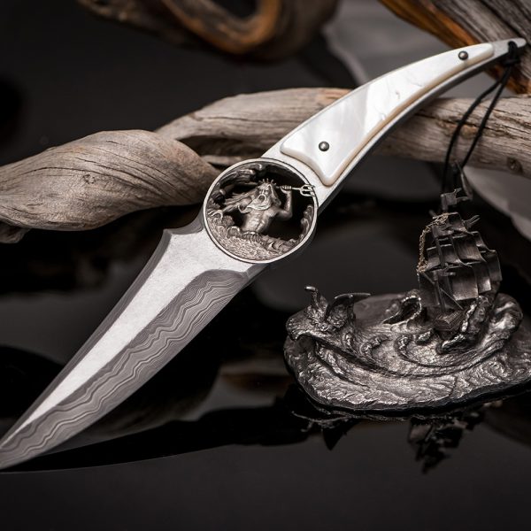 Luxurious handmade knife. The blade is made of weatherproof damask sterl ZDI-1016, with layered patterns repeating the movement of waves.