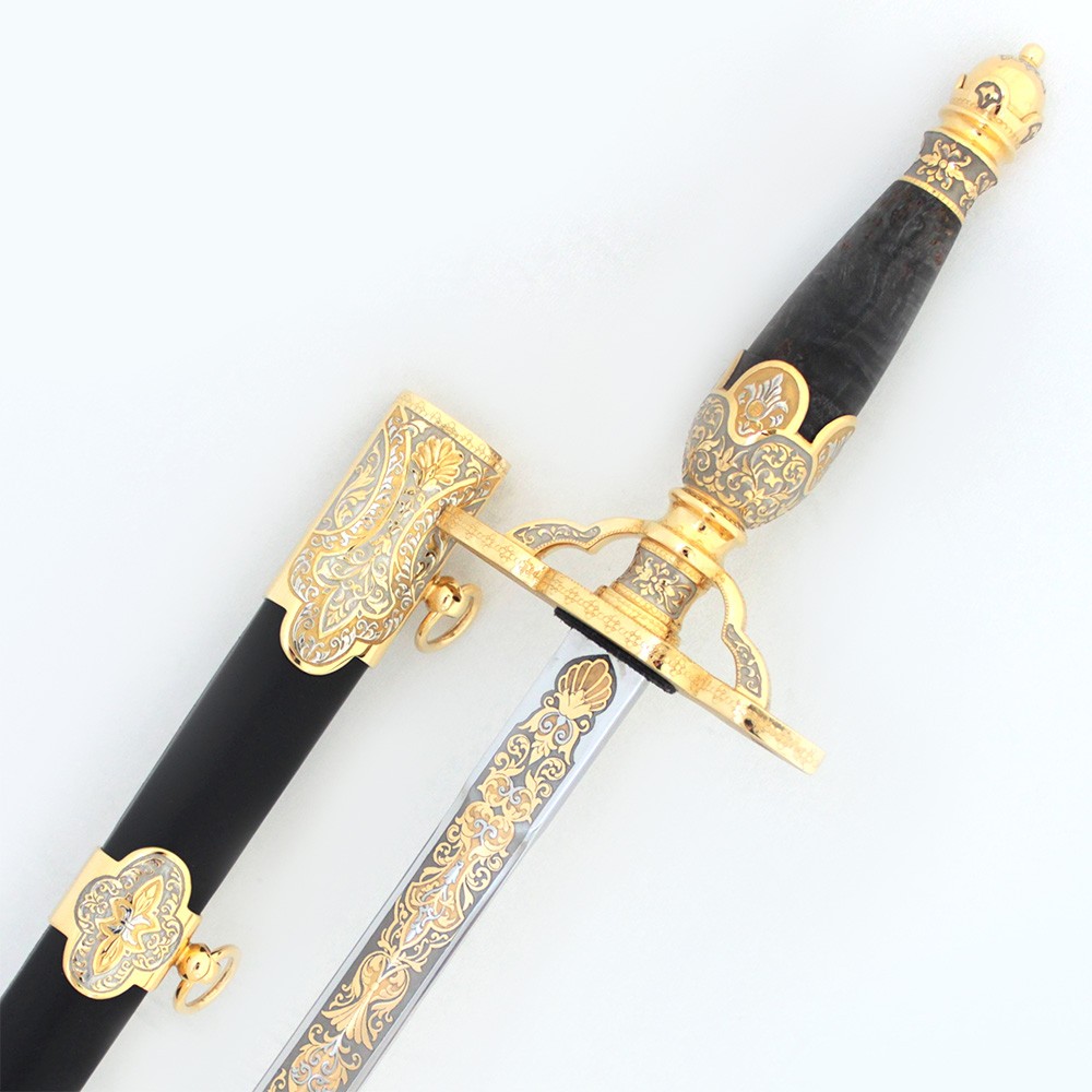 Gift dagger with a straight guard. The handle is decorated in wood and metal.