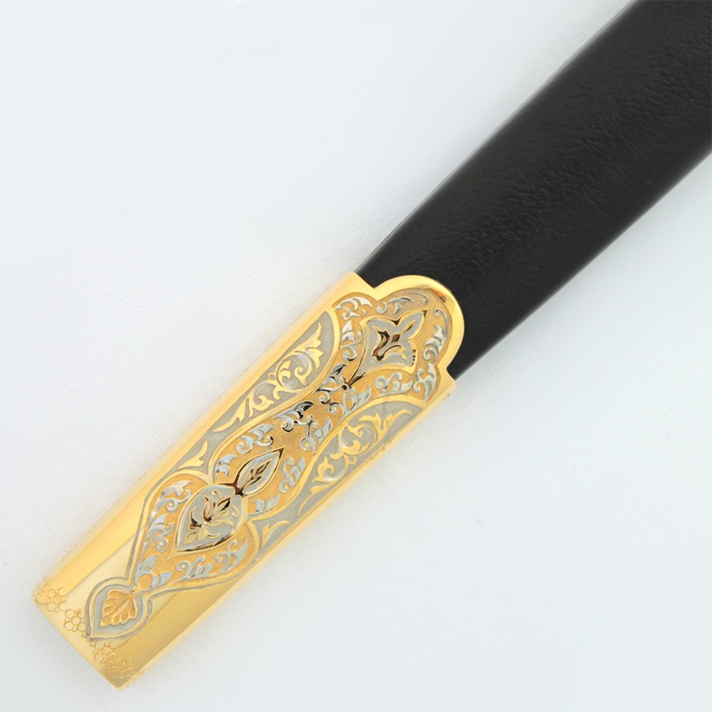 Gold tip sheath covered in black leather