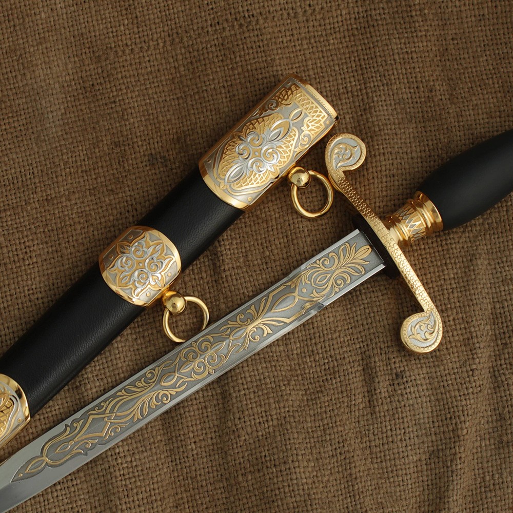 Decorated dagger with gold engraving on the blade. Leather and adjustment sheaths