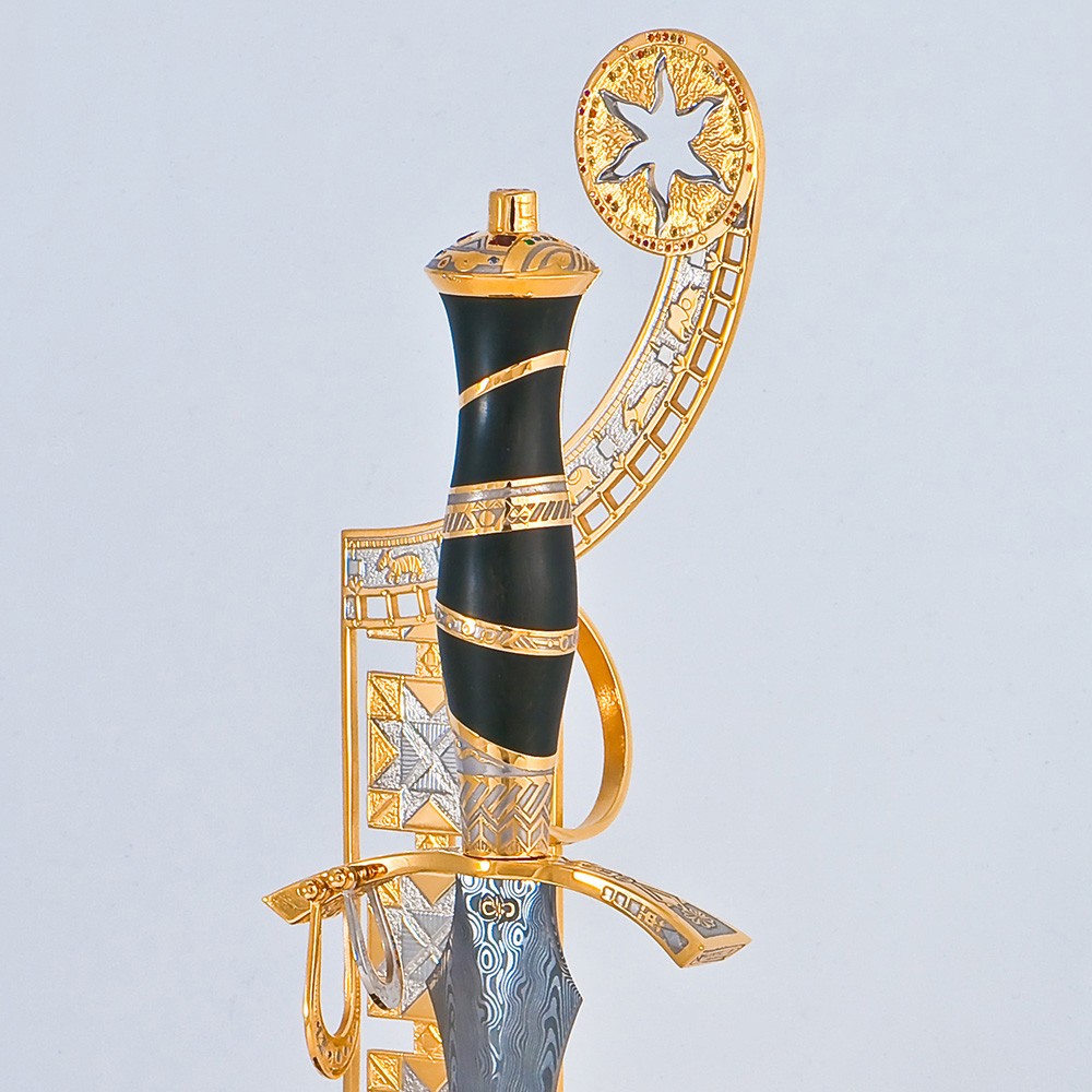 Author's composition by Tatyana Sultanova. Damask steel dagger on a gold stand decorated with precious stones
