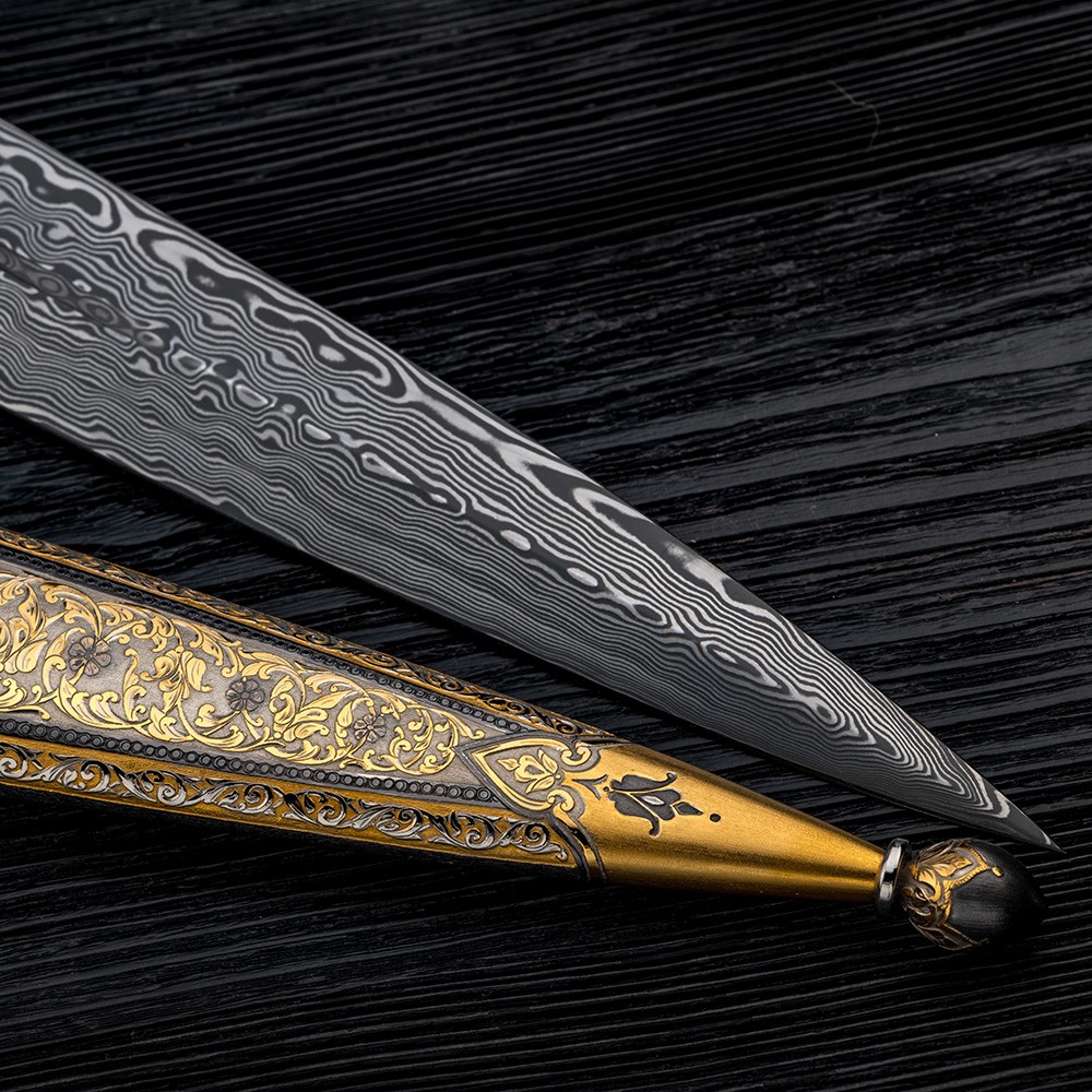 Art Damascus blade on black wood.