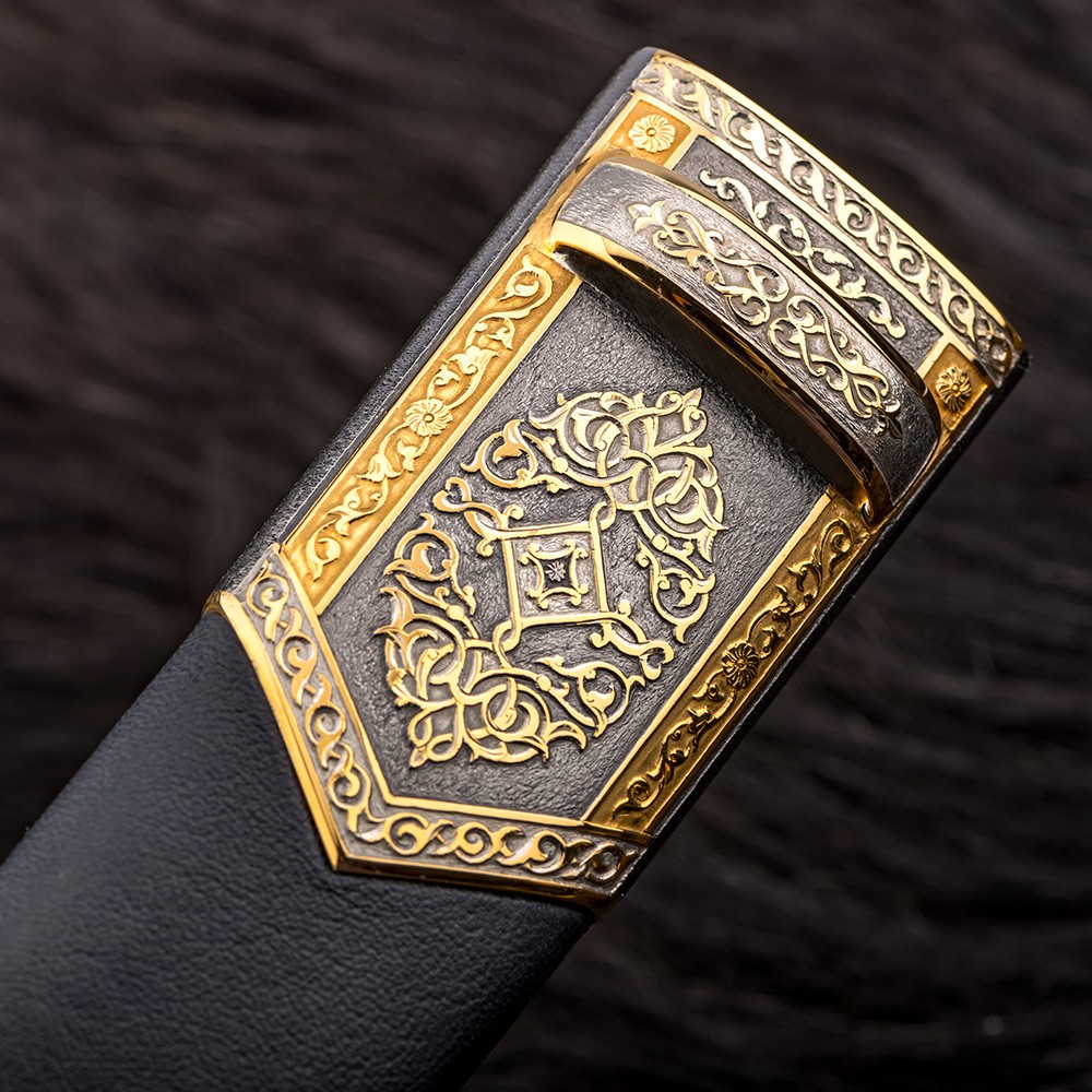 Dagger sheath with jewelry engraving. The surface is coated with rhodium-plated metal of the platinum group