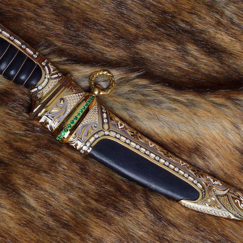 Metal scabbard with leather insert decorated with green crystals