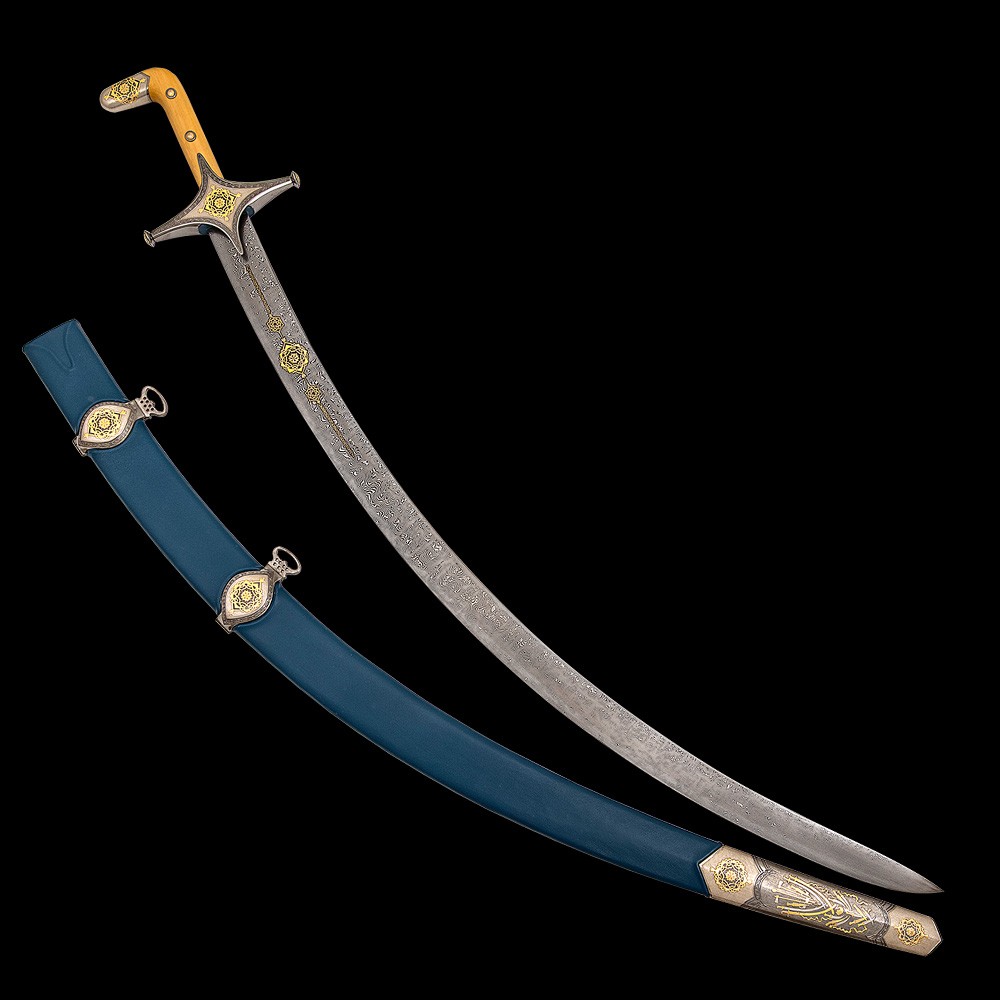 The saber blade is narrow, but thick enough, strongly curved. This blade curvature has historical roots and recalls the combat version of this weapon, capable of delivering very effective blows when cutting. Dark steel has a clearly visible characteristic damask pattern.