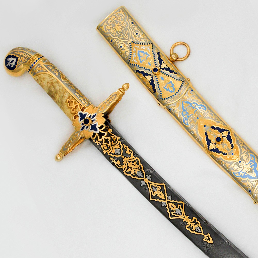 Arabic sword with a wooden hilt and a damascus blade with 24K gold plating and ornamental enamel