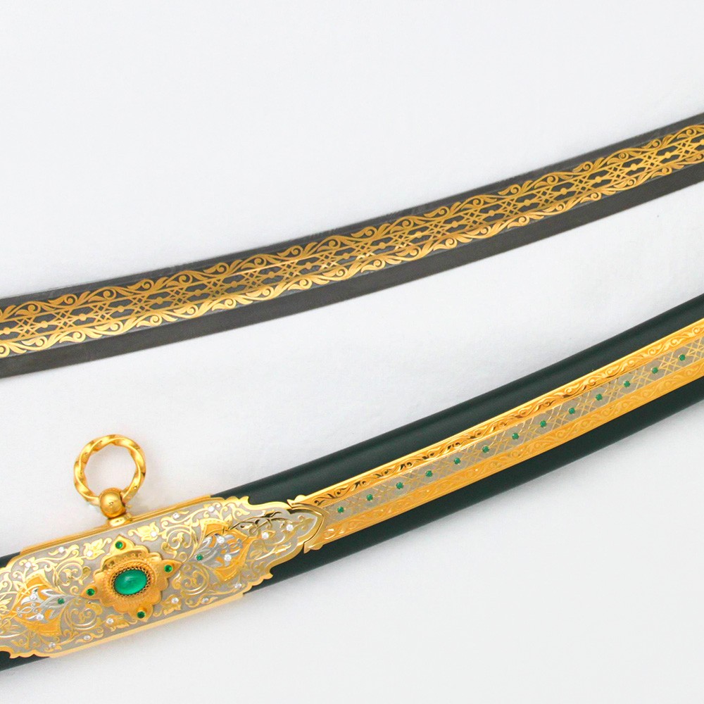 Decorated scabbard covered in green leather. Damascus steel blade decorated with 24K gold art ornament.