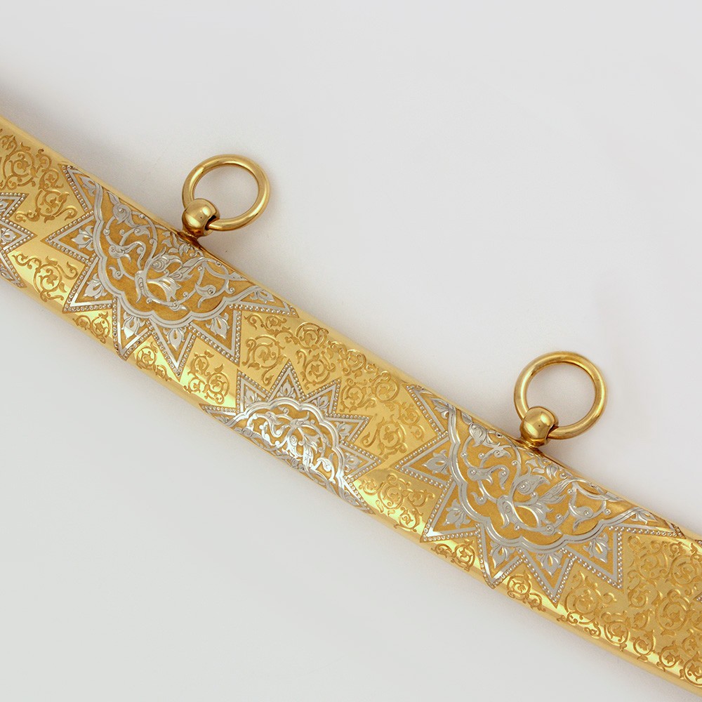 Gold sheath of arabic sword with arabic ornament
