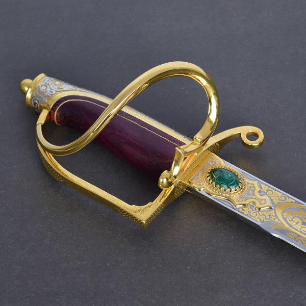 Decorated sword with golden hilt