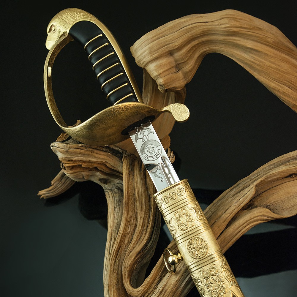 Handmade souvenir sword. The handle has a hilt and the head of an eagle.