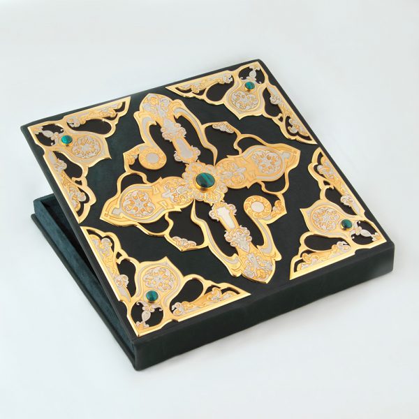 Handwork. Leather and velvet box with gold carvings for storing a luxurious necklace
