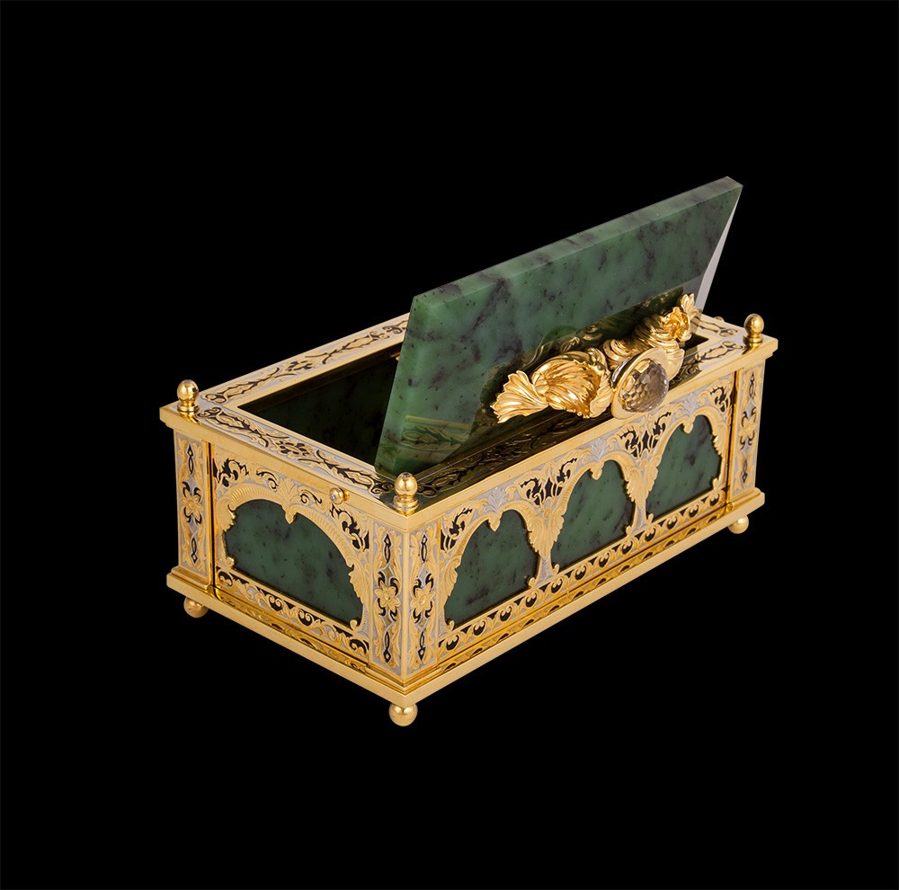 All metal elements of the casket are plated with gold and manually engraved using the technique of Zlatoust engraving on metal. The casket comes with a wooden gift box.