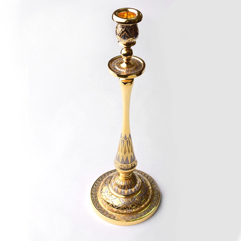 Golden candelabra with a thickened barrel