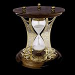 Luxury hourglass with wooden base and gold mount
