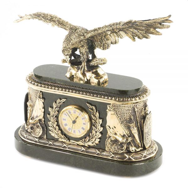 Bronze eagle on a stone rock made of natural jade. Luxury handmade clock for the fireplace.