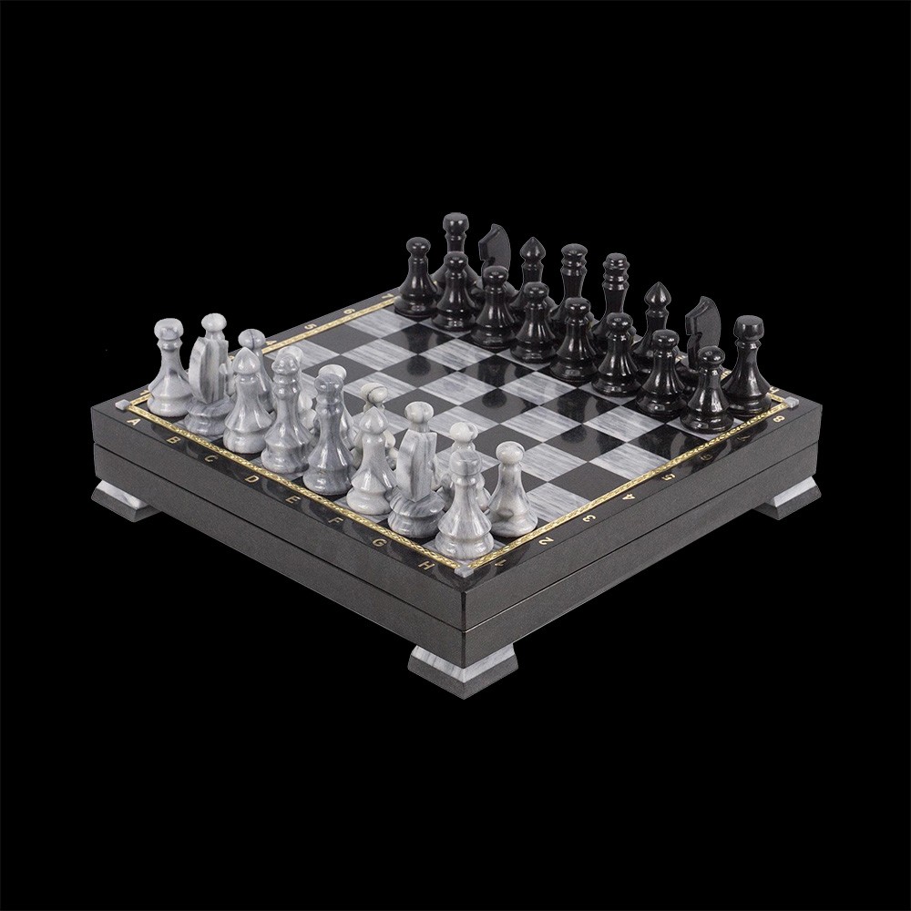 Handmade stone chess polished to a mirror shine. Cell color is black and graphite.