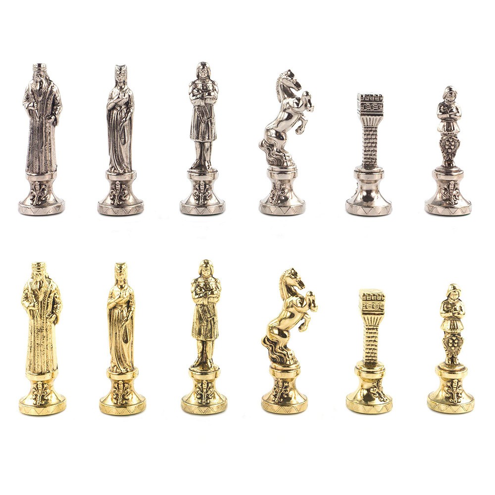 Set of chess pieces in gold and silver colors.
