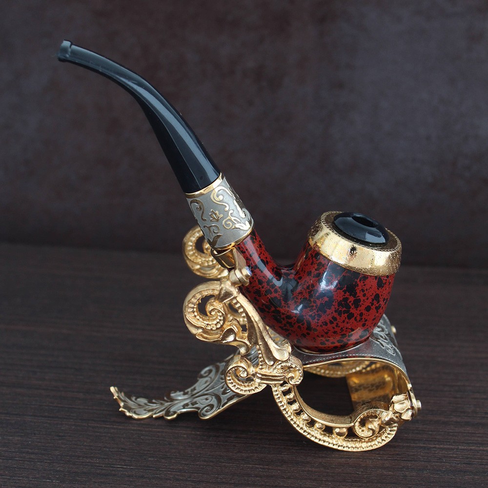 Exclusive manual smoking pipe on a gold stand. A great gift option for a connoisseur of tobacco.