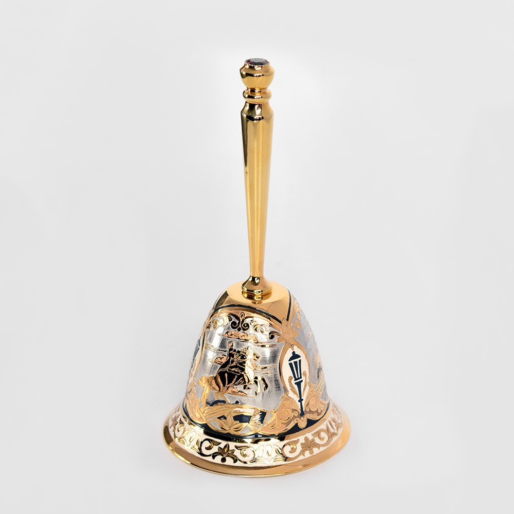 Table bell covered with gold and drawings