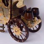 The carriage is a bar. Able to carry up to 6 glasses. The wheels of the carriage are able to move. Jewelry handmade.