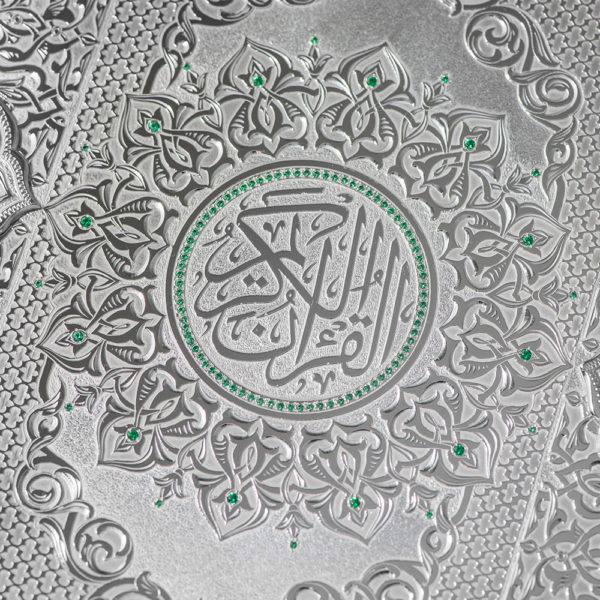 The Quran is embellished with green stones