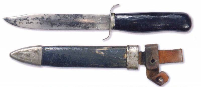 Knife with a different version of the sheath, equipped with a strap for the handle.