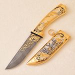 Damascus steel knife with golden sheath