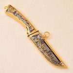 Damascus steel knife with golden sheath